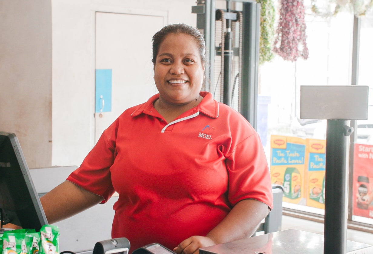 Cash register operator smiling politely