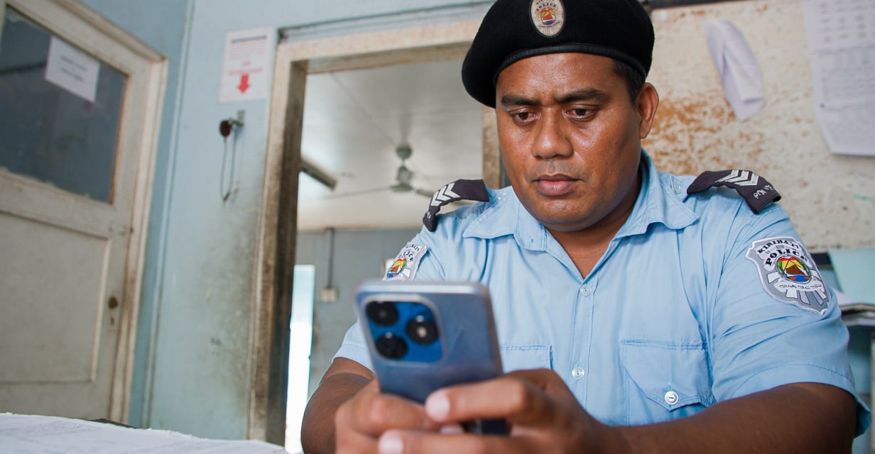 Policeman looking at his phone